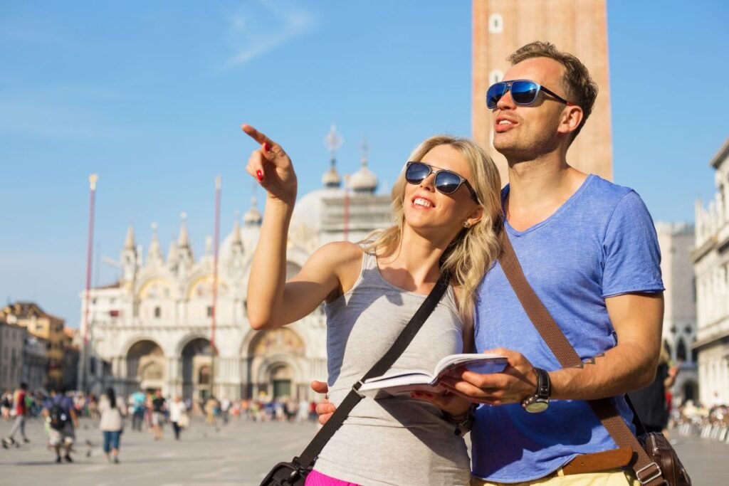 couple on a city break looking a guide map